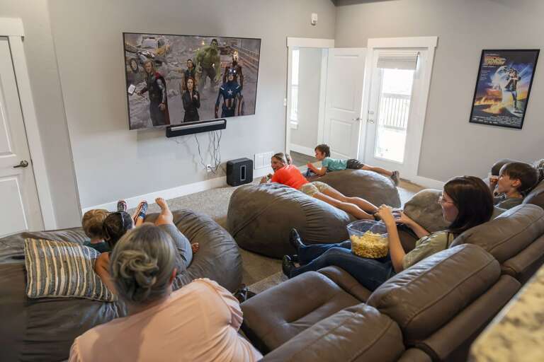 Family Lounging, Large Leather Sofa, Living Room, TV Watching Family Lounging, Large Leather Sofa, Living Room, TV Watching