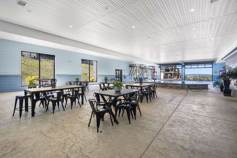 Spacious Dining Area With Sleek Black Chairs And Panoramic Windows