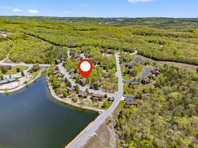 Aerial View Of A Lakeside Residential Area With Location Marker