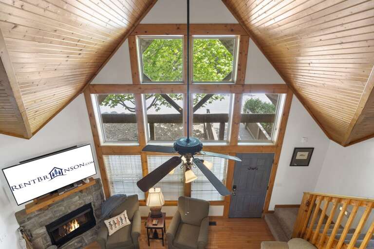Interior View With High Ceilings, Fireplace, And Large Windows