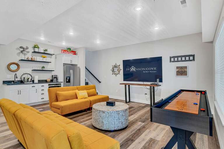 Kids and adults alike will have a marvelous time in the downstairs game room.