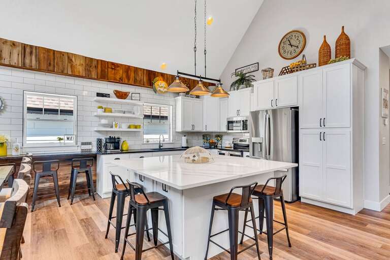 Interior Of A Kitchen With Island And Stools