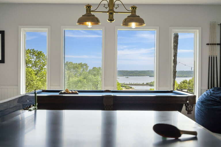 Interior View With Billiard Table And Lake Through Windows