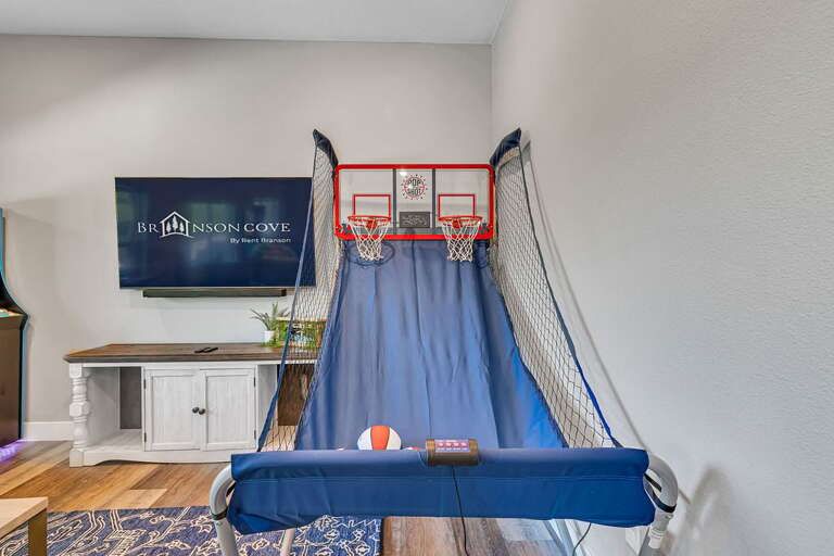 Interior With Basketball Hoop Over Bed And Decorative Fireplace