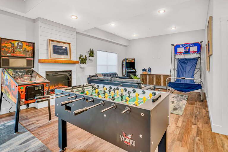 Living Room With Foosball, Arcade Games, And Basketball Arcade