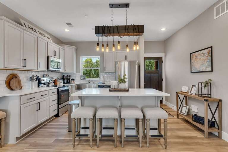 Interior Of A Residential Kitchen With Island And Stools Interior Of A Residential Kitchen With Island And Stools