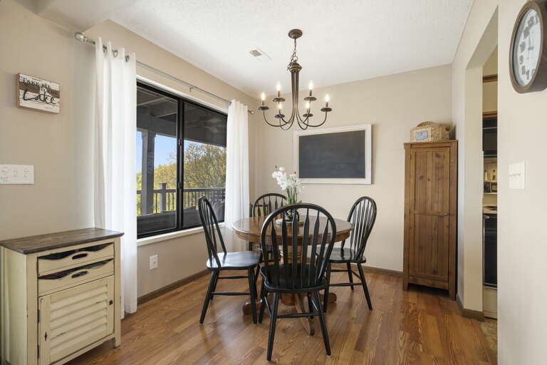 Dining Room With Table, Chairs, And Chandelier