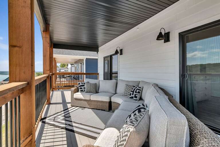 Outdoor Balcony Seating Area With Sofa And Ocean View