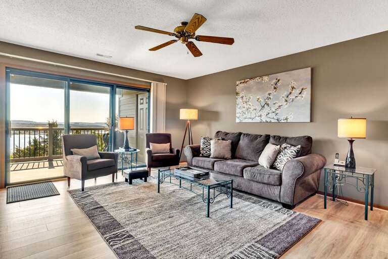 Living Room With Furniture And Balcony Access Living Room With Furniture And Balcony Access