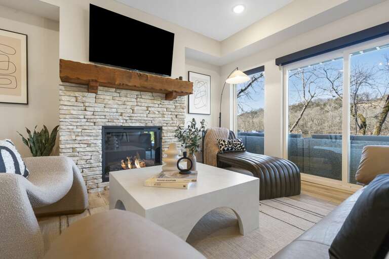 Living Room With Fireplace And Large Window