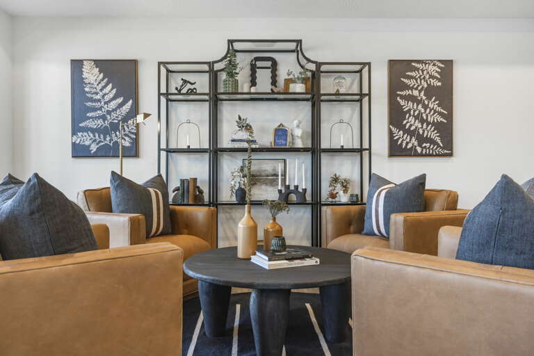 Living Room With Sofas, Table, And Shelving Unit Living Room With Sofas, Table, And Shelving Unit