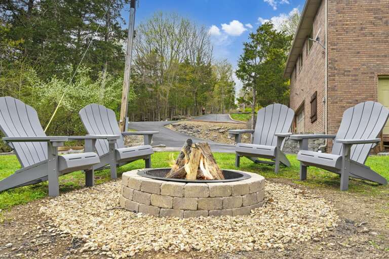 Outdoor Chairs Around Fire Pit Near Building Outdoor Chairs Around Fire Pit Near Building