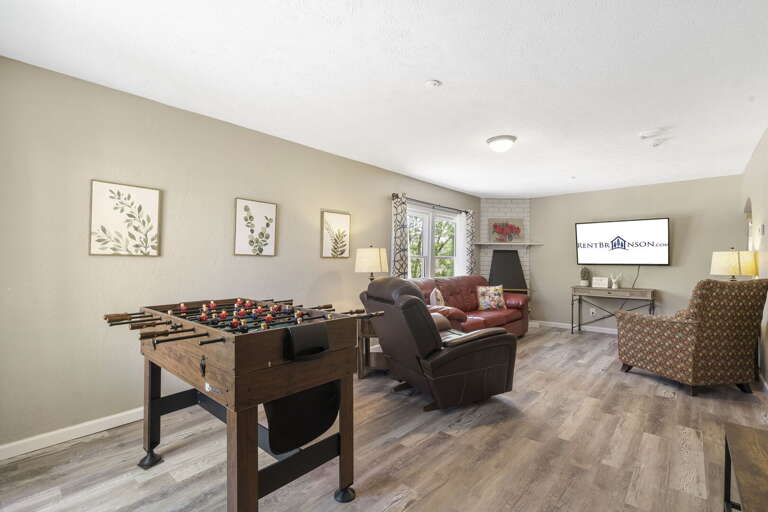 Interior Living Space With Foosball Table And Television