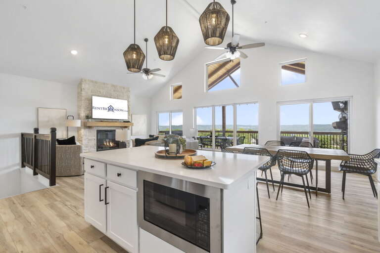 Interior Of A Vacation Rental Kitchen And Dining Area With Ocean View