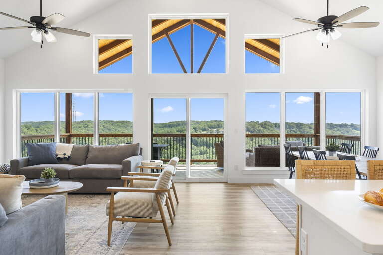 Living Room With Large Windows And Scenic View