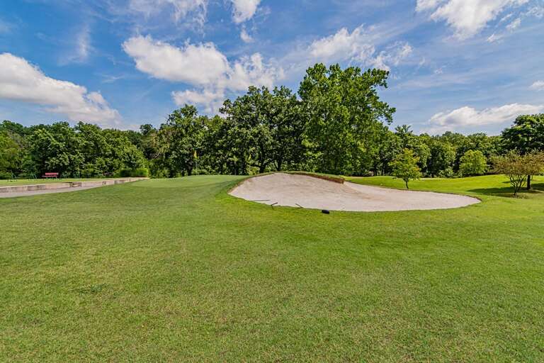 Golf Course With Sand Bunker And Trees