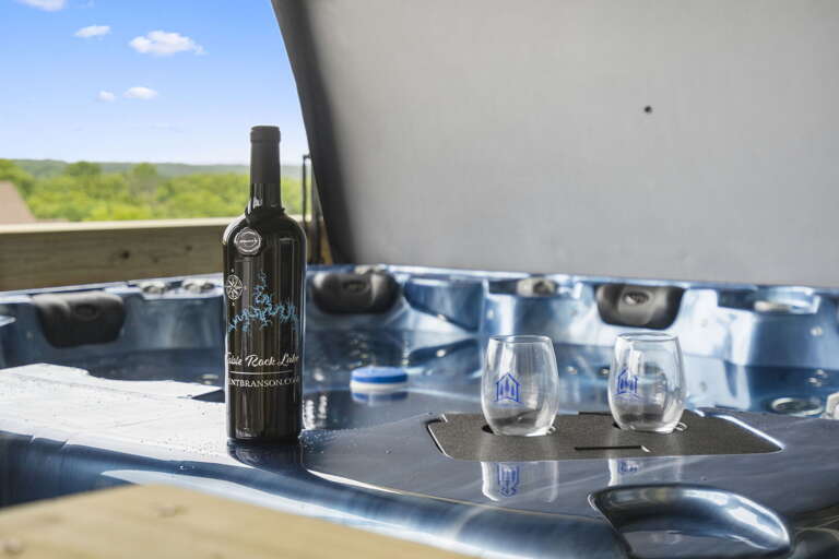Bottle Of Wine And Two Glasses On Hot Tub Edge With Scenic View Bottle Of Wine And Two Glasses On Hot Tub Edge With Scenic View