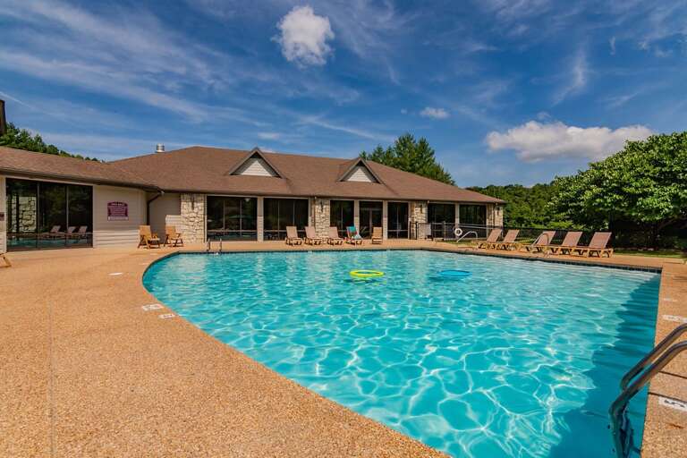 House With Swimming Pool And Deck Chairs Under Blue Sky House With Swimming Pool And Deck Chairs Under Blue Sky