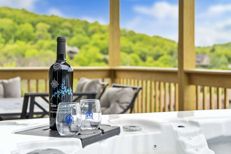 Balcony View With Wine Bottle, Glasses, And Jacuzzi