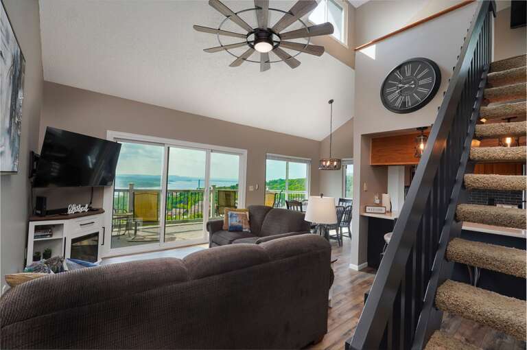 Interior Living Space With Staircase And View Of Landscape Interior Living Space With Staircase And View Of Landscape