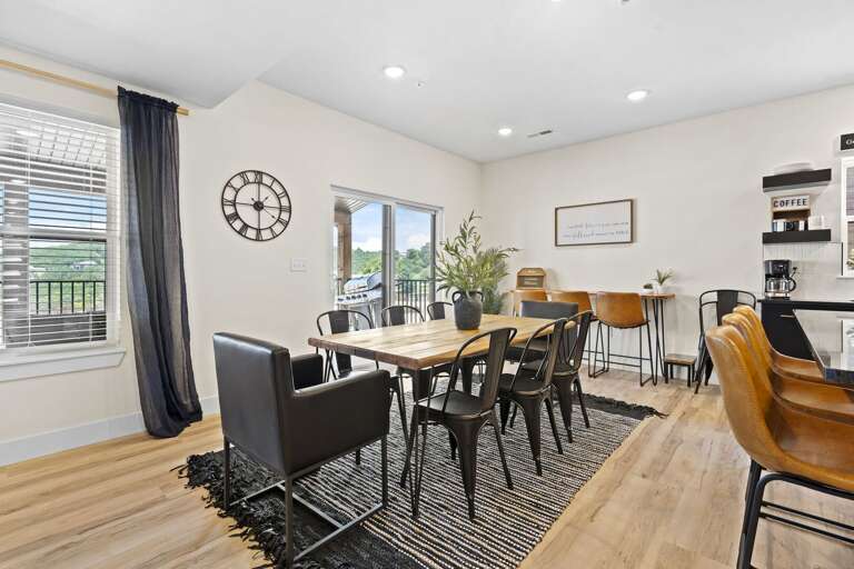 Bright Dining Area In Vacation Rental With Large Table And Open Kitchen
