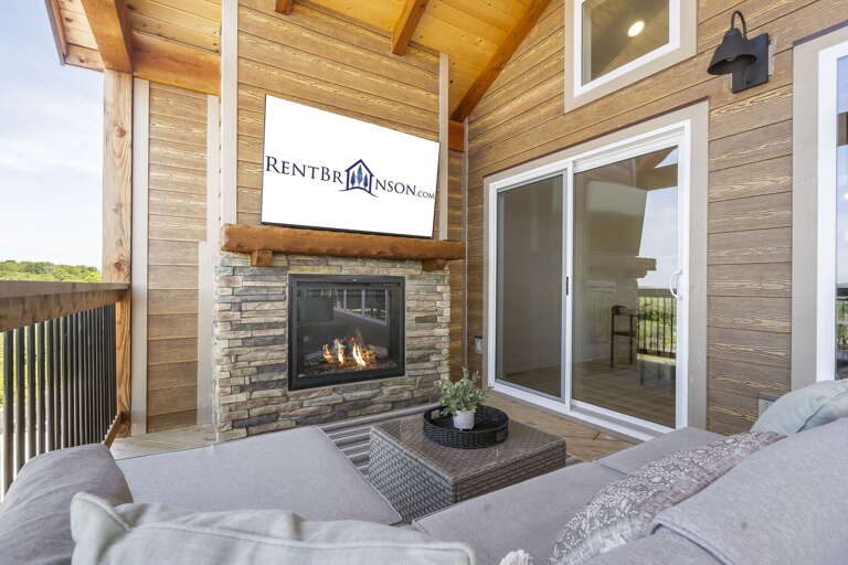 Outdoor Seating Area With Fireplace And Sliding Door