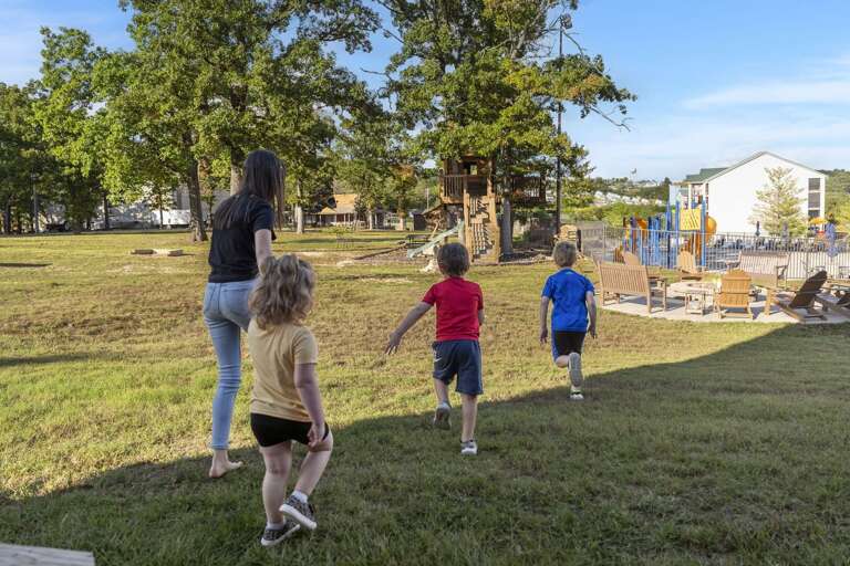 Family Frolics On Grassy Getaway Near Playground
