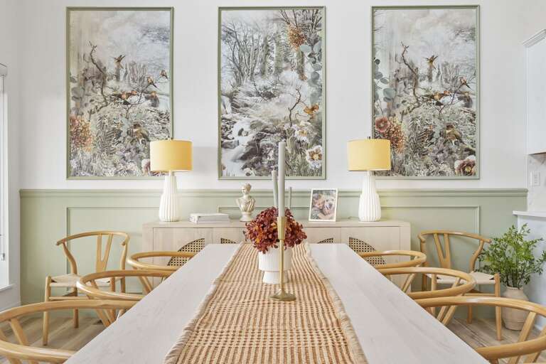 Dining Room With Table, Chairs, And Decorative Wall Art