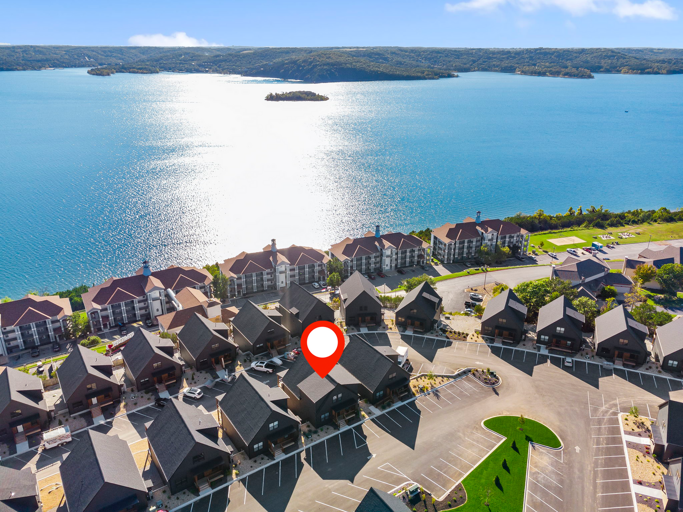 Aerial View Of Lakeside Vacation Rental Complex With Location Marker