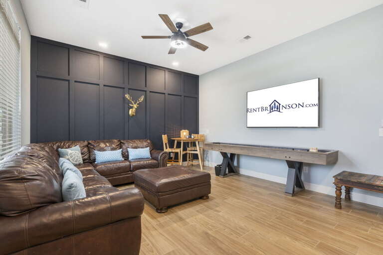 Living Area With Leather Sofa And Flatscreen TV