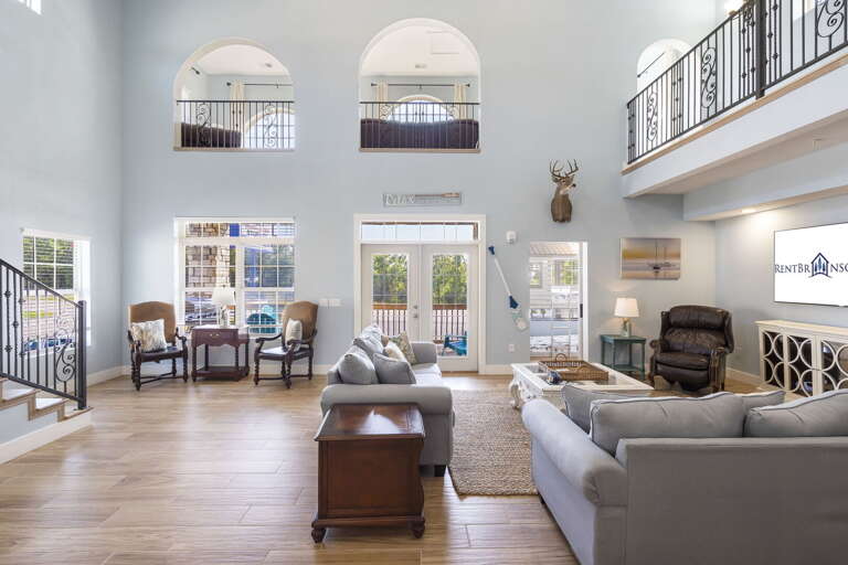 Spacious Living Room With High Ceiling And Mezzanine