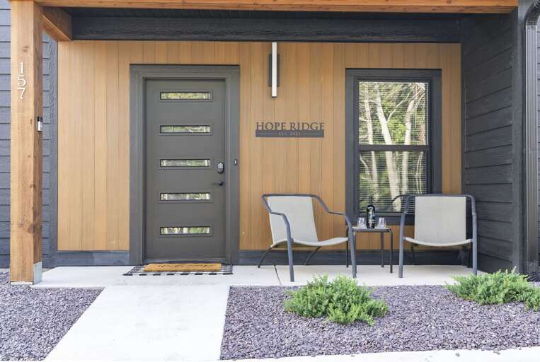 Residential Entrance With Wooden Door And Chairs Residential Entrance With Wooden Door And Chairs