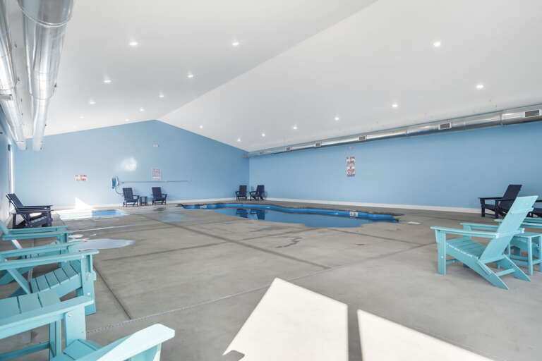 Indoor Swimming Pool With Blue Chairs Indoor Swimming Pool With Blue Chairs