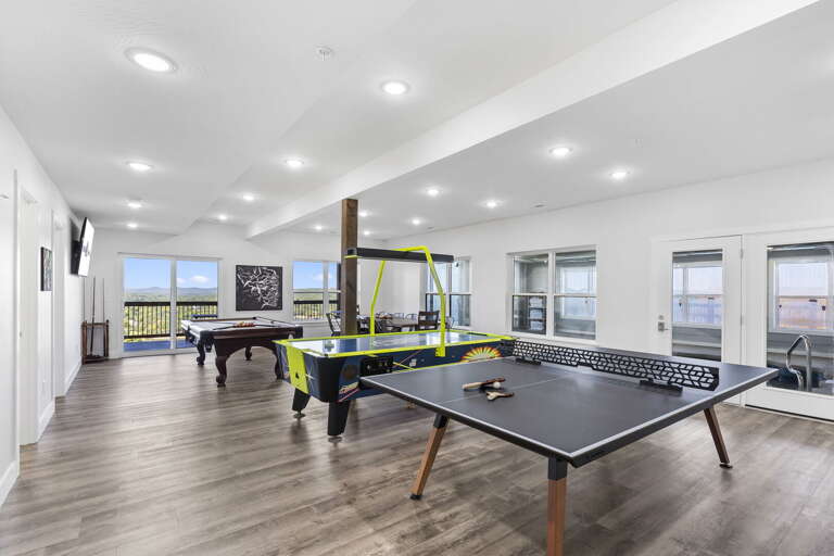 Game Room With Table Tennis And Air Hockey Tables