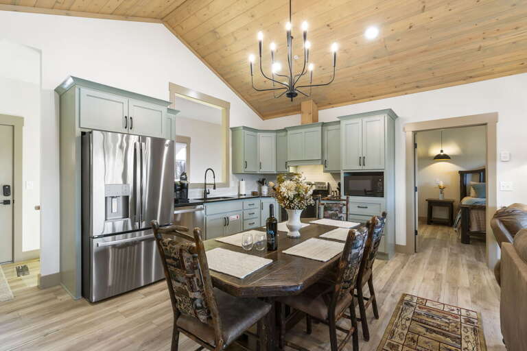 Interior Of A Kitchen With Dining Area And Living Room In The Background