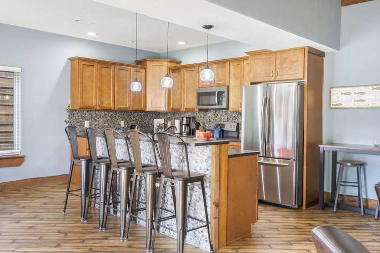 Kitchen Interior With Bar Stools And Wooden Cabinets Kitchen Interior With Bar Stools And Wooden Cabinets