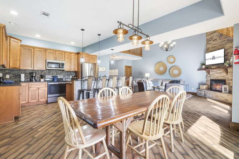 Interior Of A Residential Kitchen And Dining Area With Furniture And Appliances Interior Of A Residential Kitchen And Dining Area With Furniture And Appliances