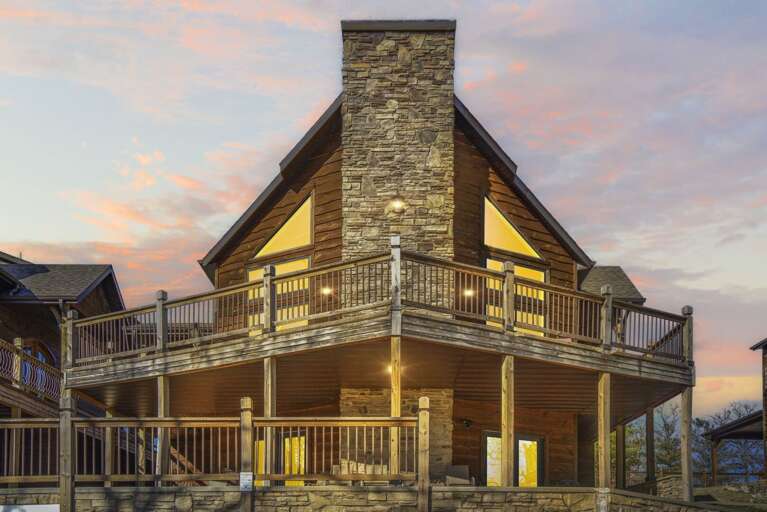 Two-story Wooden Building With Porch At Dusk