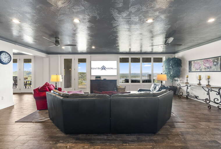Interior Living Space With Sectional Sofa And Balcony Access Interior Living Space With Sectional Sofa And Balcony Access