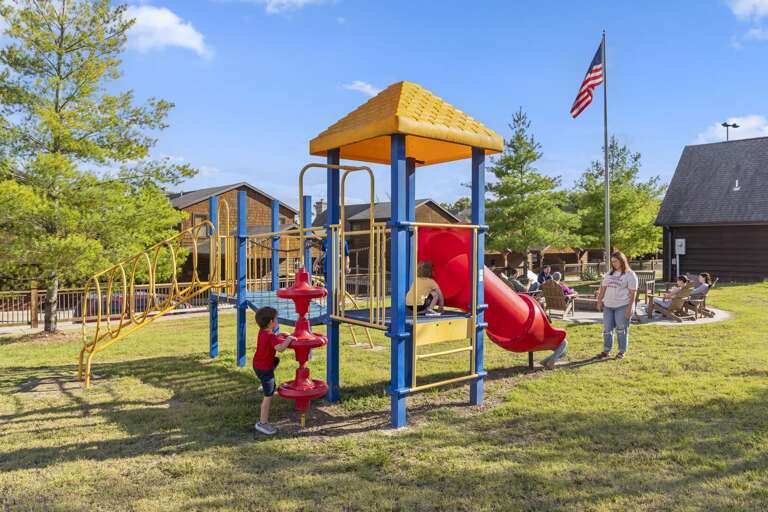 Playful Children Clamber On Colorful Playground Equipment Under A Sunny Sky Playful Children Clamber On Colorful Playground Equipment Under A Sunny Sky