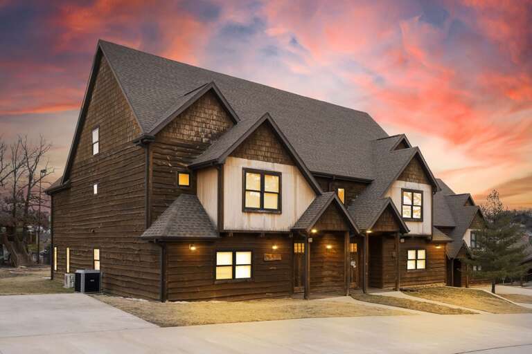Two-story Brown House At Dusk