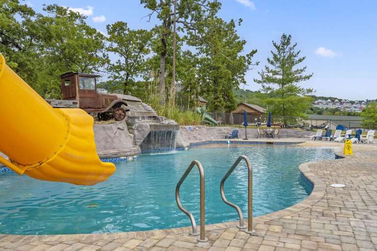 Poolside Paradise, Playful Yellow Slide Plunging Into Pristine Waters