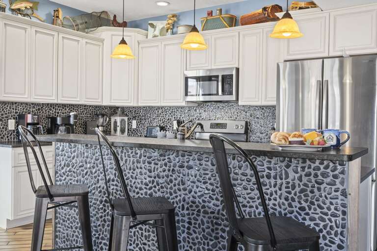 Kitchen Interior With Bar Stools And A Breakfast Counter