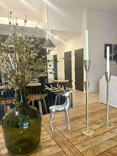 Spacious Space With Sleek Silver Stool And Suspended Spheres Spacious Space With Sleek Silver Stool And Suspended Spheres