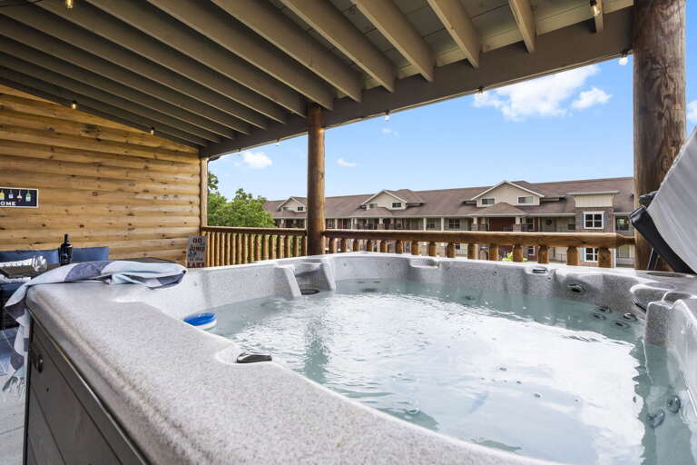 Outdoor Hot Tub On Wooden Deck With Residential Background