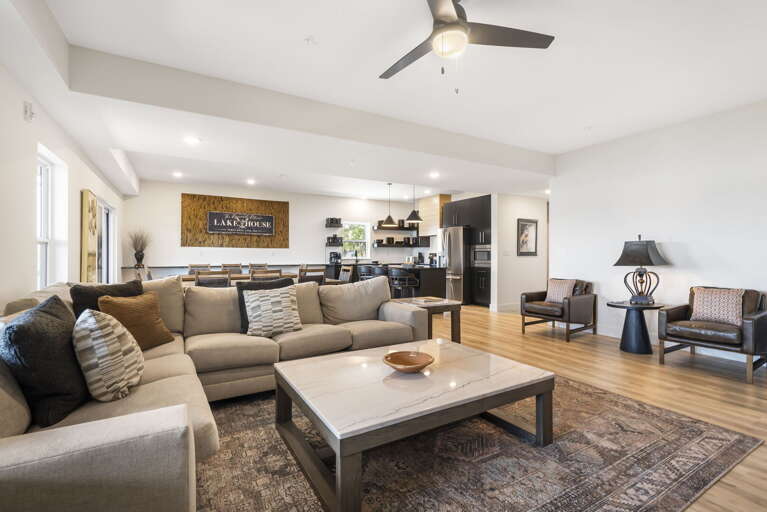 Spacious Living Room Interior With Furniture And Open Kitchen