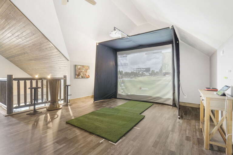 Indoor Golf Simulation In Vacation Rental Loft Space