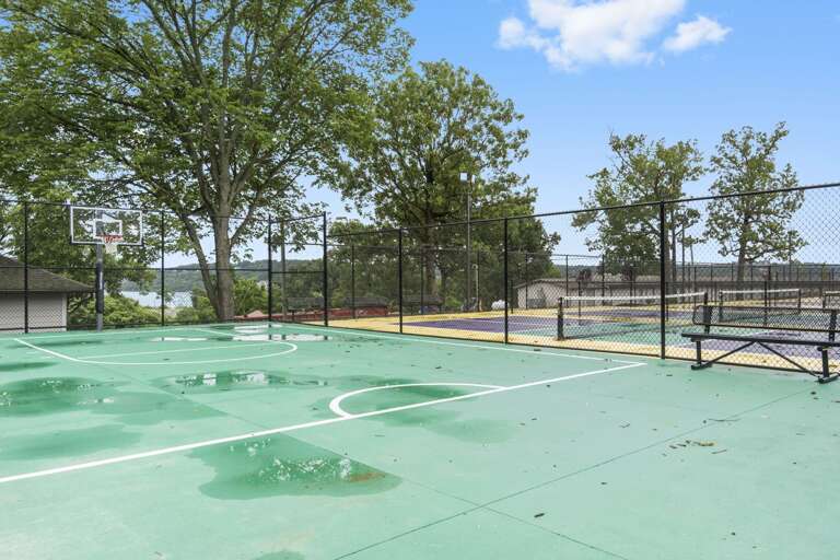 Outdoor Basketball Court With Trees And Sky