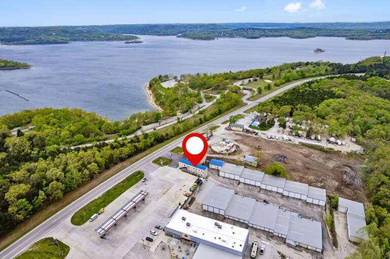 Aerial View Of Lakeside Location Marked With Red Pin Aerial View Of Lakeside Location Marked With Red Pin