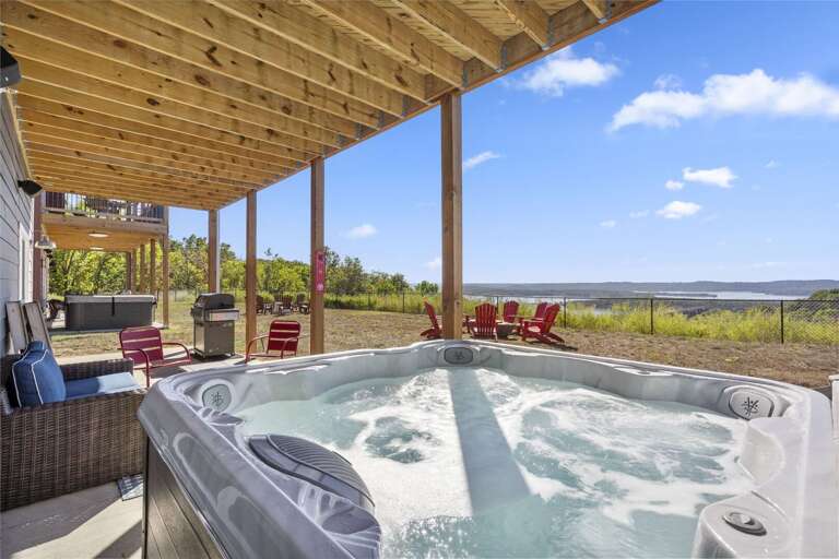 Patio View With Jacuzzi Under Wooden Overhang, Scenic Backdrop